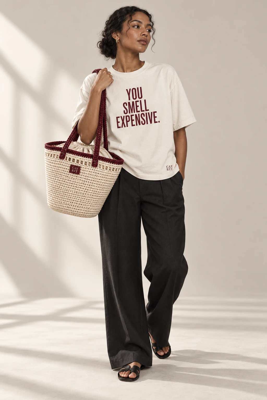 Generated model concept pairing the You Smell Expensive tee with The Sound bag.