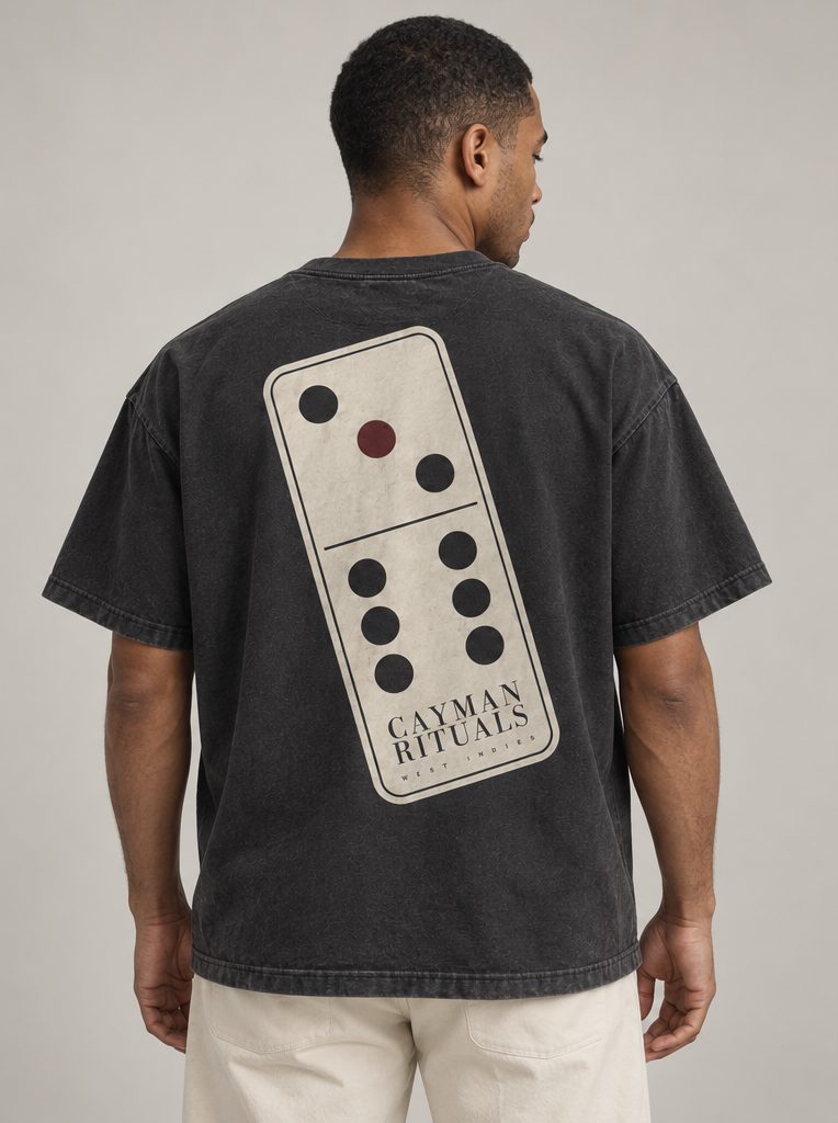 Studio render: the back of the shirt, printed with a large three-six domino carrying the Cayman Rituals signature.